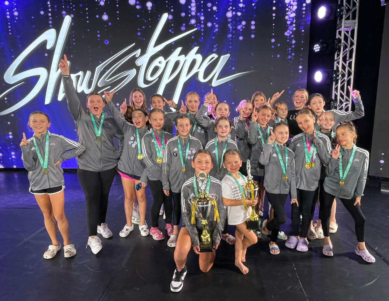 First Place Overall Junior Super Group in the Showstoppers competition in Orlando are pictured: Abby, Vivian, Madison Hughes, Sydney, Emma, Lara, Sadie, Lola, Marian, Reese, Jazzy, Reilly Hughes, Sophie, Tori, Abigail, Autumn, Scarlett, Avery, Veronica, Chantilly, Julep, Charleigh and Maclyn.